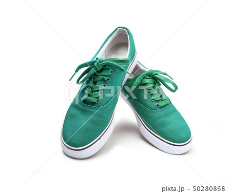 A pair of green canvas shoes isolated on white A pair of green canvas shoes isolated on white 50280868