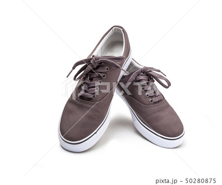 A pair of brown canvas shoes isolated on white 50280875