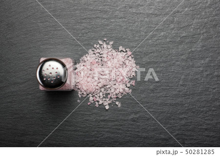 salt shaker with pink Himalayan salt on black salt shaker with pink Himalayan salt on black 50281285