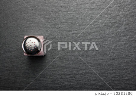 salt shaker with pink Himalayan salt on black salt shaker with pink Himalayan salt on black 50281286