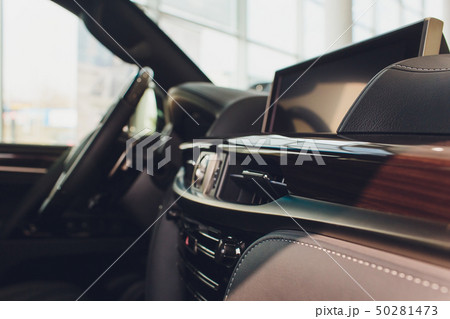 Dark luxury car Interior - steering wheel, shift lever and dashboard. Dark luxury car Interior - steering wheel, shift lever and dashboard. 50281473
