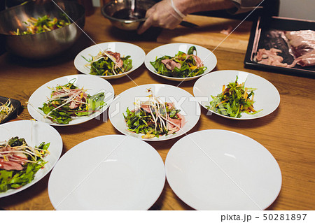 many plates of food on the holiday table. cold appetizers and salads in the restaurant. many plates of food on the holiday table. cold appetizers and salads in the restaurant. 50281897
