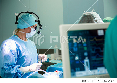 Electrocardiogram in hospital surgery operating emergency room showing patient heart rate with blur 50282097
