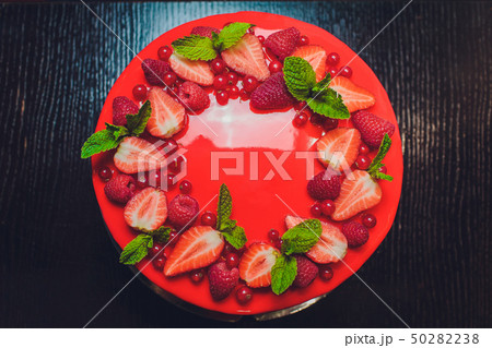 Delicious raspberry cake with fresh strawberries, raspberries, blueberry, currants and pistachios on Delicious raspberry cake with fresh strawberries, raspberries, blueberry, currants and pistachios on 50282238