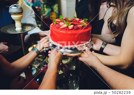 Delicious raspberry cake with fresh strawberries, raspberries, blueberry, currants and pistachios on 50282239