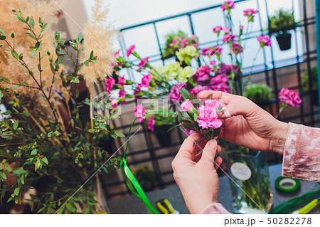 Process of creating a bouquet florist flower shop close-up. Woman hands and implement. Process of creating a bouquet florist flower shop close-up. Woman hands and implement. 50282278