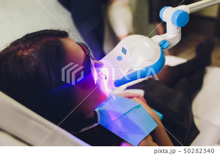 Doctor dentist explain the implant of teeth to patient in dental clinic. Doctor dentist explain the implant of teeth to patient in dental clinic. 50282340