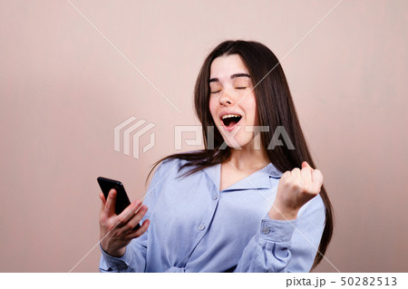 Happy woman winning online Happy woman winning online 50282513