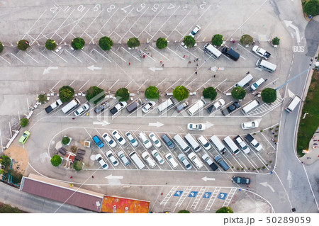 Car in parking lot with traffic arrow sign on Car in parking lot with traffic arrow sign on 50289059