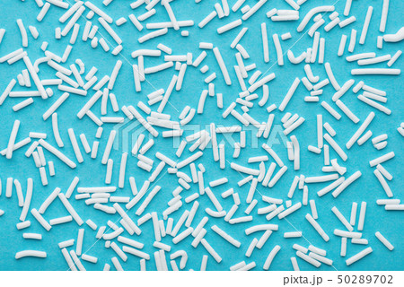 white sprinkles over blue background, festive white sprinkles over blue background, festive 50289702