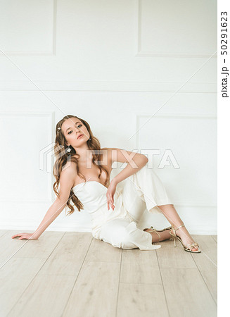 Beautiful young bride in a white dress  50291623