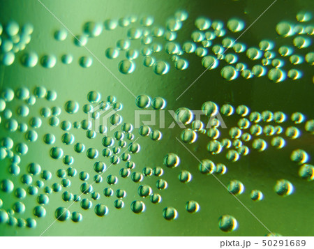 Movable, active bubbles in mineral water 50291689
