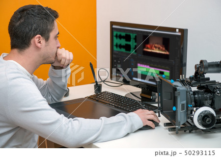 young man designer using graphics tablet for video 50293115