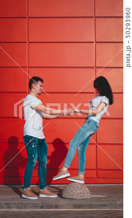 Young smiling couple in love, man holding attractive woman hand 50293960