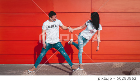Young smiling couple in love, man holding attractive woman hand 50293962
