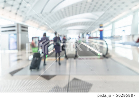 Airport blurred background interior with travelers Airport blurred background interior with travelers 50295987