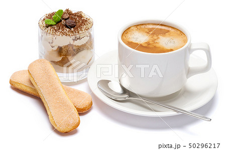 Classic tiramisu dessert in a glass and cup of coffee isolated on a white background with clipping 50296217