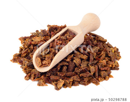 Propolis granules in a wooden shovel are isolated 50298788