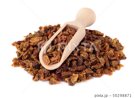 Propolis granules in a wooden scoop. Isolated on 50298871