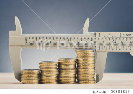 vernier caliper and stacking coins on desk vernier caliper and stacking coins on desk 50301817