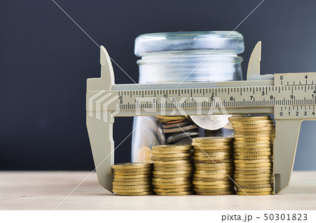 vernier caliper and stacking coins on desk vernier caliper and stacking coins on desk 50301823