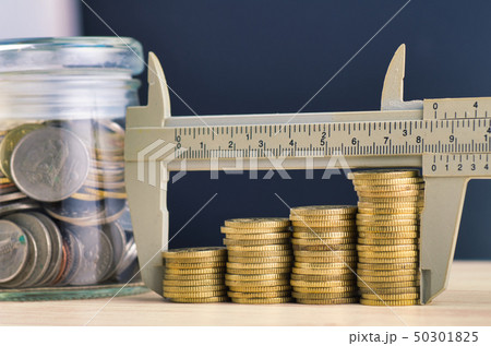 vernier caliper and stacking coins on desk vernier caliper and stacking coins on desk 50301825