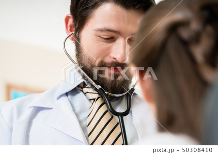 Doctor checking patient Doctor checking patient 50308410