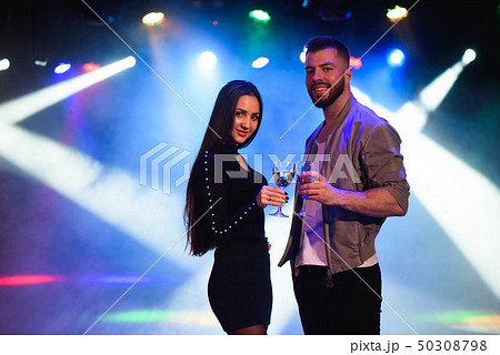 Image of happy young couple having fun at disco. 50308798