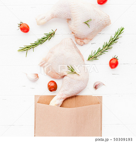 Fresh raw chicken legs with herbs. Cooking concept Fresh raw chicken legs with herbs. Cooking concept 50309193