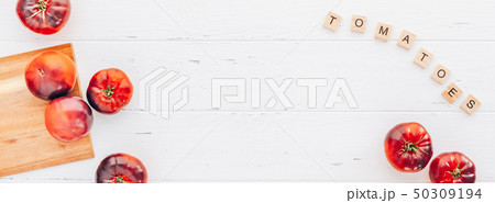 Tomatoes Mar Azul on white wooden table background 50309194