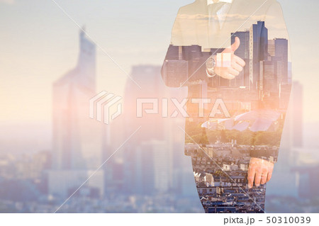 Business man shows thumb up with multiple exposure. Global business concept 50310039