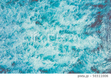 Aerial view to ocean waves. Blue water background. 50311006