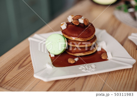 Stack of delicious homemade pancakes with almond Stack of delicious homemade pancakes with almond 50311983