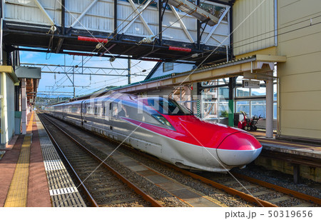 Shinkansen train stopping at railway station 50319656