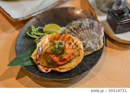 Grilled fresh scallop with soil sauce Grilled fresh scallop with soil sauce 50319731