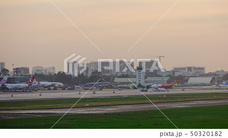 Passenger airplanes docking at the airport 50320182
