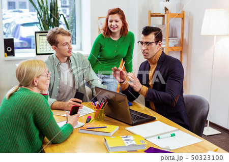 Nice handsome man gesticulating with his hands Nice handsome man gesticulating with his hands 50323100
