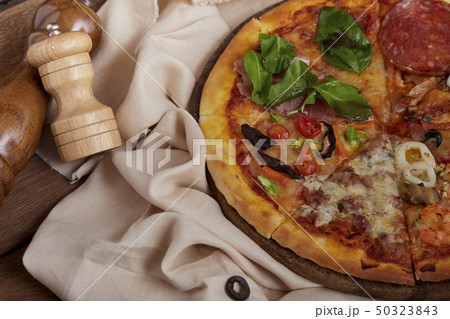 Delicious fresh prepared pizza i Delicious fresh prepared pizza i 50323843