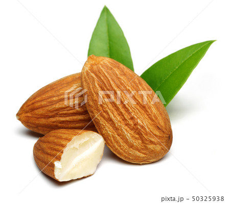 Group of almonds with leaves isolated on white 50325938