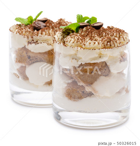 two portions Classic tiramisu dessert in a glass isolated on a white background with clipping path 50326015
