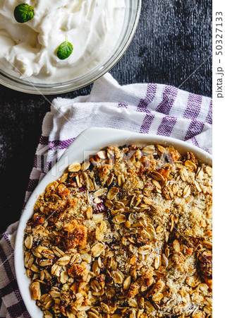 Granola and curd creamy tzoghurt with mint on a Granola and curd creamy tzoghurt with mint on a 50327133