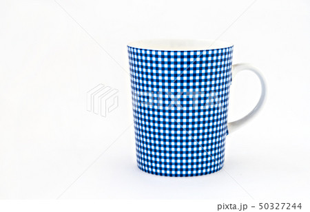 light blue cup on old wooden dark background 50327244
