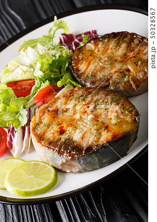 grilled sturgeon steaks with vegetable salad grilled sturgeon steaks with vegetable salad 50328567