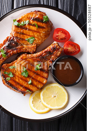 Delicious grilled pork steak in a spicy tamarind Delicious grilled pork steak in a spicy tamarind 50328687