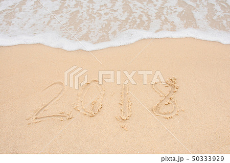 Soft wave and Number 2018 of sea on empty sandy 50333929