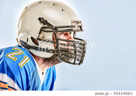 American football player posing on white background 50334062