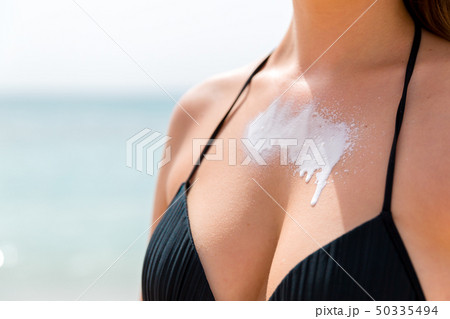 Beautiful young woman is enjoying sunshine at the Beautiful young woman is enjoying sunshine at the 50335494