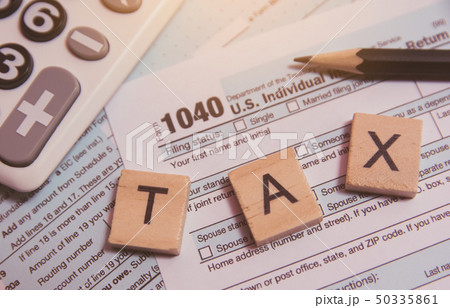 Tax with wooden alphabet blocks, calculator, Tax with wooden alphabet blocks, calculator, 50335861