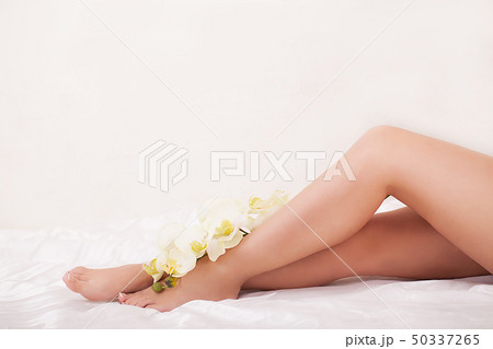 Close up of woman doing massage for her smooth legs 50337265