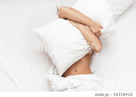 Woman in the bed don't want to wake up in morning Woman in the bed don't want to wake up in morning 50338416